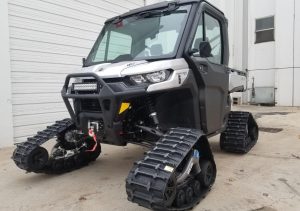 Can Am Defender with UTV Tracks for rent